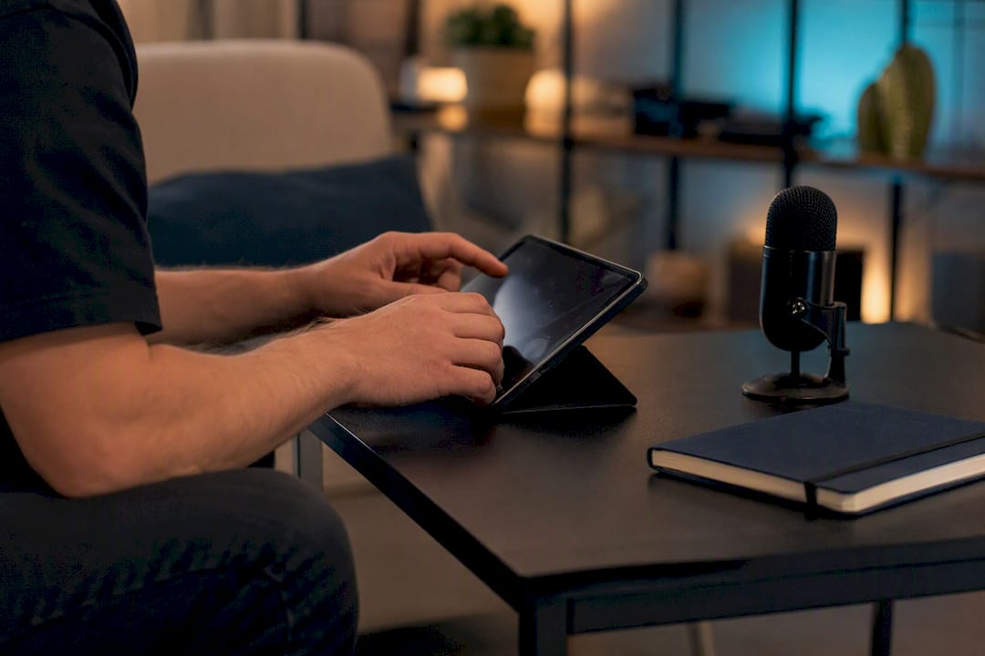 Hands preparing video captions on devices
