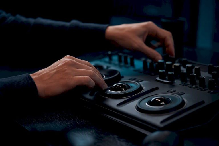 Hands adjusting camera slider in editing suite